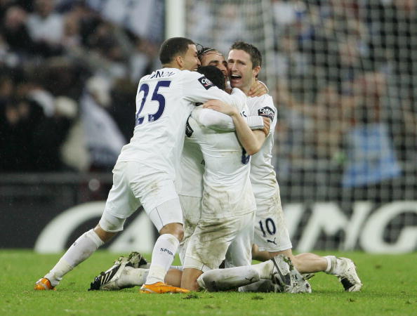 LONDON - FEBRUARY 24:  (L-R) Aaron Lennon, Dimitar Berbatov, Jermaine Jenas and Robbie Keane of Tottenham Hotspur celebrate victory following the Carling Cup Final between Tottenham Hotspur and Chelsea at Wembley Stadium on February 24, 2008 in London, England. Tottenham Hotspur won 2-1 after extra time. (Photo by Phil Cole/Getty Images)