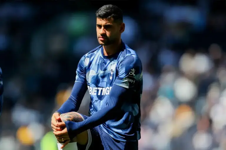 Cristian Romero warms up in Tottenham Hotspur kit